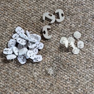 White and Clear Plastic baby proofing outlet covers and finger guards like new